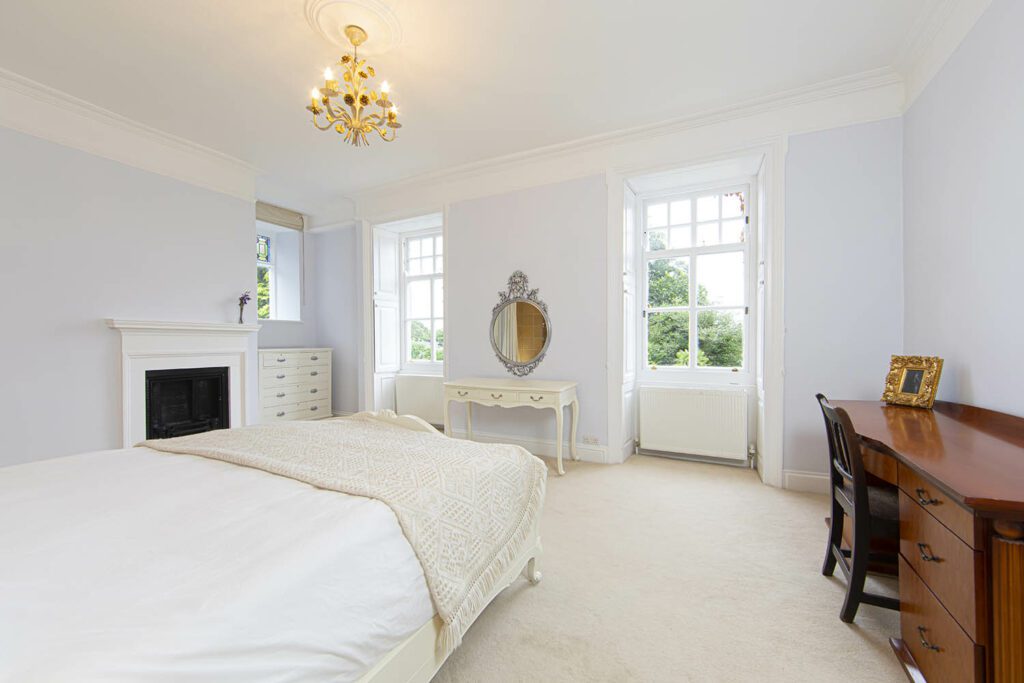 Beautiful king sized bedroom with high ceilings in Plas Cilybebyll holiday mansion